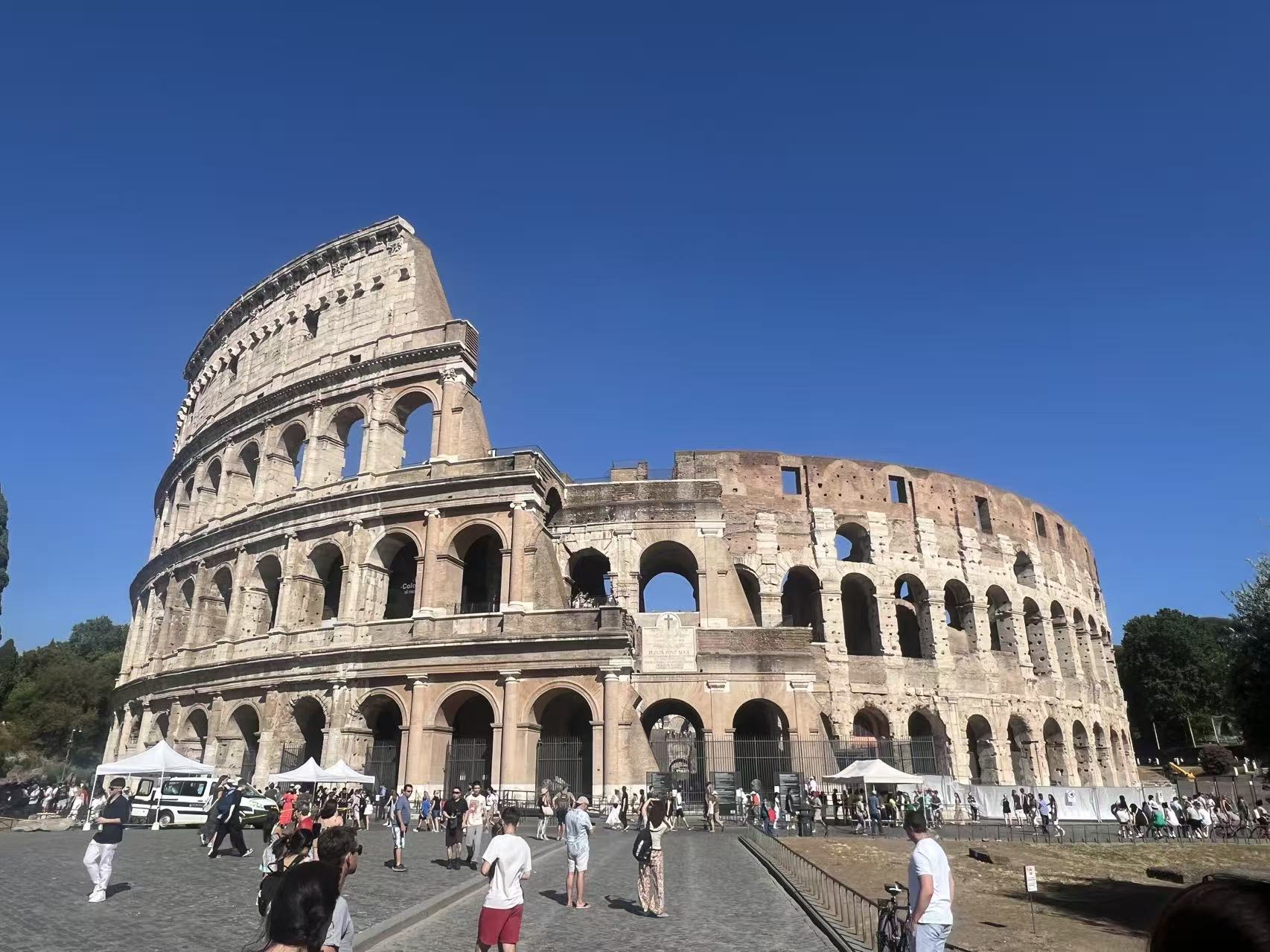 The Colosseum under a deep blue sky
